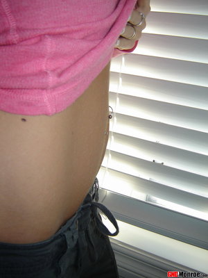 18 year old girl Megan Rain removes her sandals and then clothes to pose naked